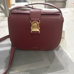 Senreve Wine Red Crossbody Bag with Gold Accent